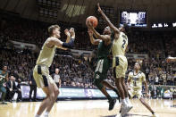 Michigan State guard Cassius Winston (5) shoots between Purdue guard Eric Hunter Jr. (2) and center Matt Haarms (32) during the first half of an NCAA college basketball game in West Lafayette, Ind., Sunday, Jan. 12, 2020. (AP Photo/Michael Conroy)
