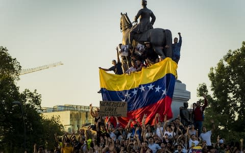 housands of protesters gather at Plaza Baquedano to demonstrate their support for opposition leader Juan Guaido - Credit: Getty /Agencia Makro