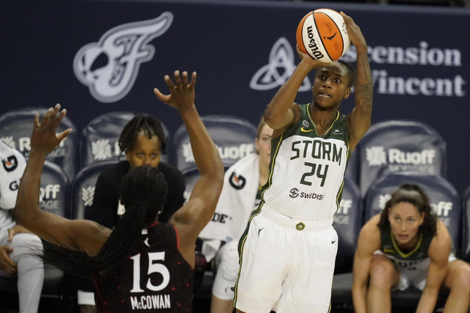 Seattle Storm's Jewell Loyd shoots over Indiana Fever's Teaira McCowan during the second half of a WNBA basketball game Thursday, June 17, 2021, in Indianapolis. (AP Photo/Darron Cummings)