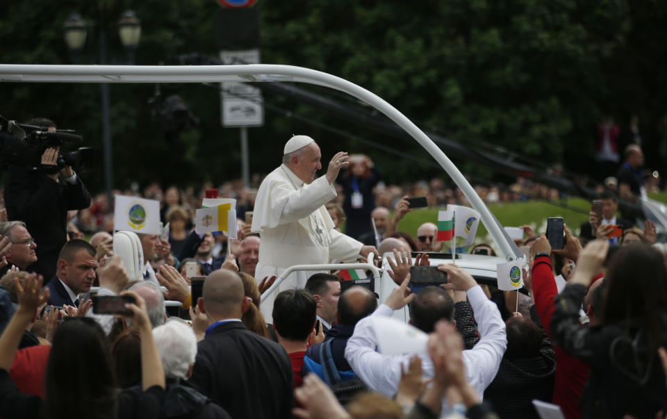 Pope Francis is welcomed by faithful as he arrives to celebrate Mass in Knyaz Alexandar Square in Sofia, Bulgaria, Sunday, May 5, 2019. Pope Francis is visiting Bulgaria, the European Union's poorest country and one that taken a hard line against migrants, a stance that conflicts with the pontiff's view that reaching out to vulnerable people is a moral imperative. (AP Photo/Darko Vojinovic)