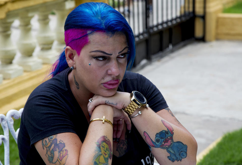 In this June 28, 2019, photo, Dianelys Alfonso, singer whose voice won her the label "Goddess of Cuba" sits during an interview with The Associated Press in Havana, Cuba. She became the center of a new phenomenon in Cuba when she publicly denounced another renowned musician, flutist and bandleader José Luis Cortés, accusing him of repeatedly hitting and raping her during her time as vocalist for NG La Banda, one of the best-known Cuban bands of the last three decades. (AP Photo/Ismael Francisco)