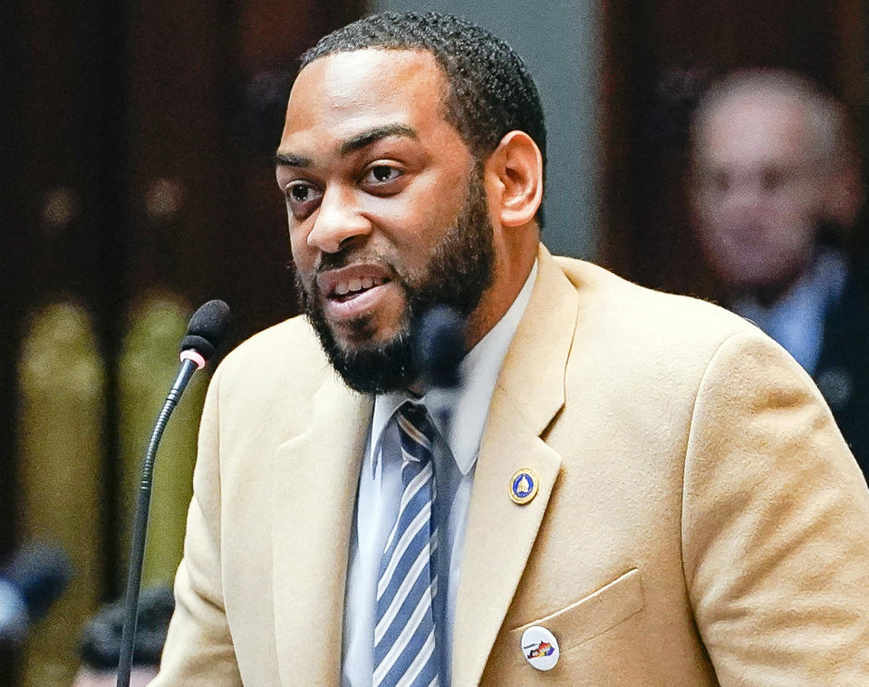 FILE - In this Feb. 19, 2020, file photo, state Rep. Charles Booker speaks on the floor of the House of Representatives in the State Capitol in Frankfort, Ky. Looking to flex his newfound influence after his Senate campaign fell just short, Booker reached out Thursday, July 2, 2020 to help unite Kentucky Democrats behind Amy McGrath's uphill fight to unseat Republican Senate Majority Leader Mitch McConnell. (AP Photo/Bryan Woolston, File)