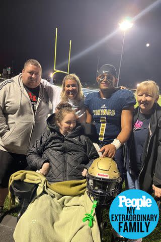 <p>Peggy Means</p> Jennifer Flewellen at son Julian's high school varsity football game with (from left) brother Kyle, friend Cassie Lee, son Julian and mom Peggy Means