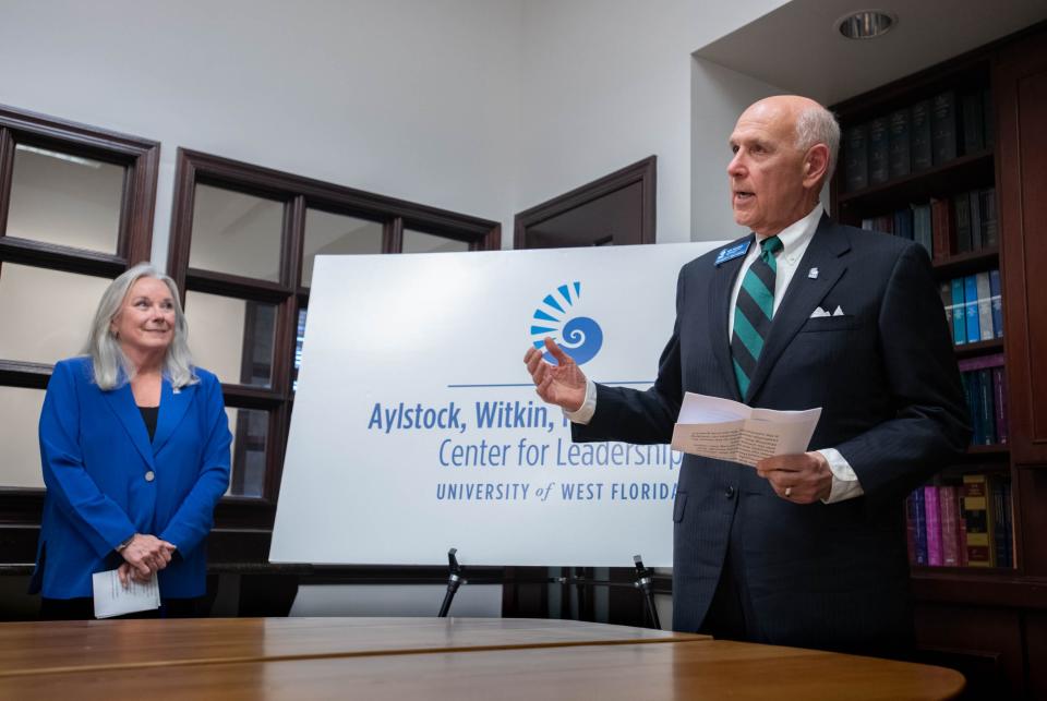 UWF President Martha Saunders, left, listens as Richard Fountain, dean of the College of Business, talks about the naming of the Aylstock, Witkin, Kreis & Overholtz Center for Leadership at the University of West Florida in recognition of a $2.5 million donation from the law firm.