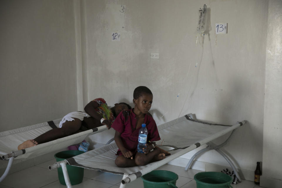 A boy suffering from cholera sits on a cot at a clinic run by Doctors Without Borders, in the Delmas neighborhood of Port-au-Prince, Haiti, Thursday, Nov. 10, 2022. Across Haiti, many patients are dying because say they’re unable to reach a hospital in time, health officials say. (AP Photo/Odelyn Joseph)