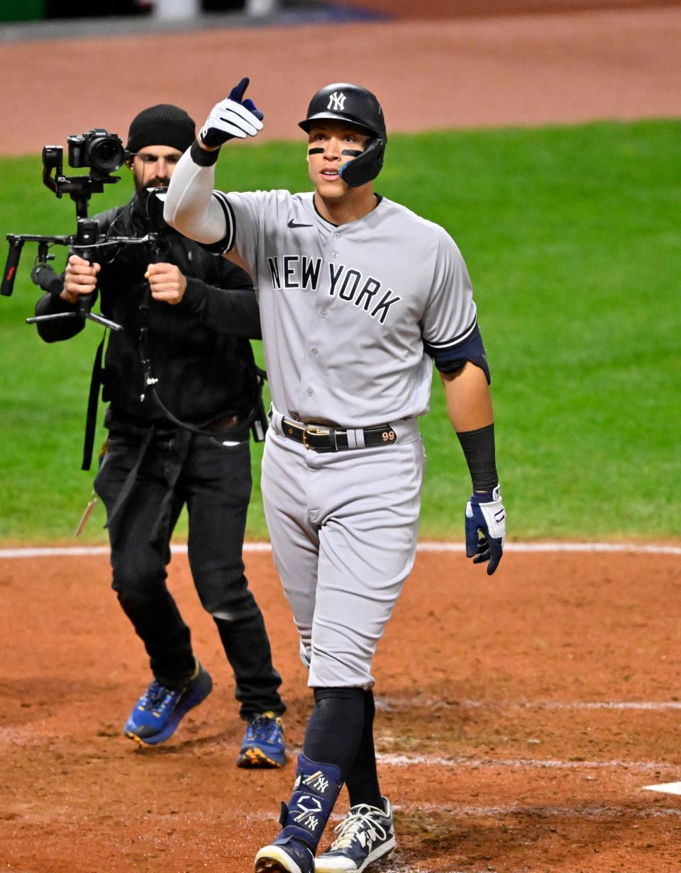 Oct 15, 2022; Cleveland, Ohio, USA; New York Yankees center fielder Aaron Judge (99) reacts after hitting a two run home run against the Cleveland Guardians in the third inning during game three of the NLDS for the 2022 MLB Playoffs at Progressive Field. Mandatory Credit: David Richard-USA TODAY Sports