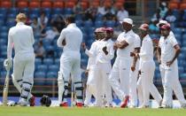 Cricket - West Indies v England - Second Test - National Cricket Ground, Grenada - 24/4/15 West Indies players celebrate the decision as England's Chris Jordan is run out Action Images via Reuters / Jason O'Brien