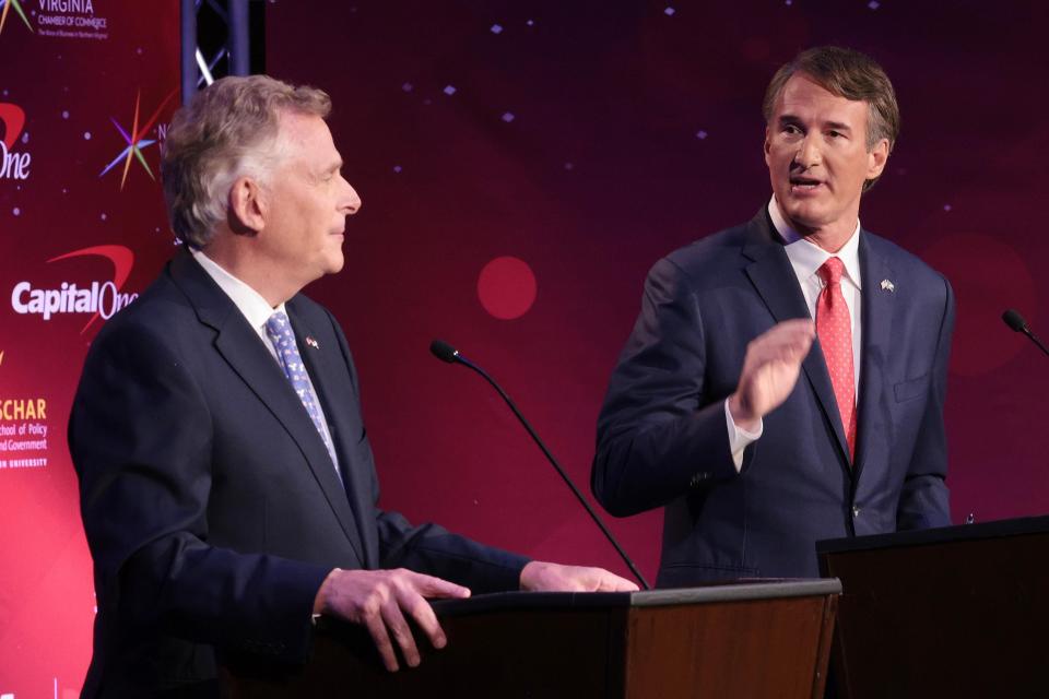 Republican Glenn Youngkin, right, makes a point to Democrat Terry McAuliffe in the final debate between the candidates before the Nov. 2 gubernatorial election.