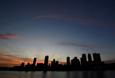 The Canary Wharf financial district is seen at dusk in London, Britain, November 17, 2017. Picture taken November 17, 2017. REUTERS/Toby Melville