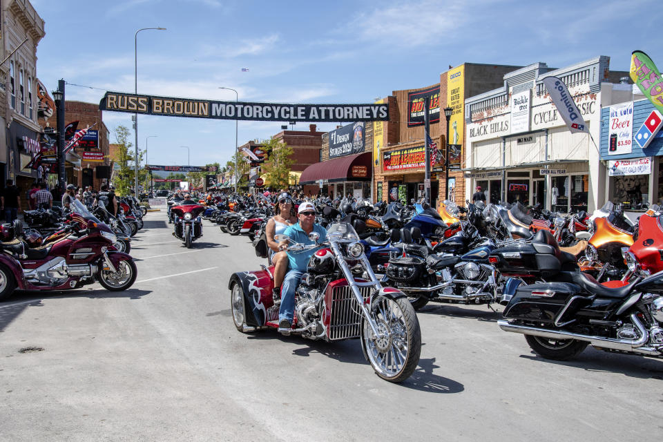 FILE - In this Saturday, Aug. 15, 2020 file photo, Bikers ride down Main Street during the 80th annual Sturgis Motorcycle Rally in Sturgis, S.D. Health officials across five states have linked 178 virus cases to the Sturgis Motorcycle Rally. In the three weeks since the rally kicked off, coronavirus cases in South Dakota have shot up at a startling pace. (Amy Harris/Invision/AP, File)