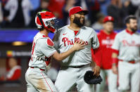Philadelphia Phillies catcher Garrett Stubbs, left, and pitcher José Alvarado, right, celebrate after defeating the New York Mets 5-4, Monday, May 13, 2024, in New York. (AP Photo/Noah K. Murray)
