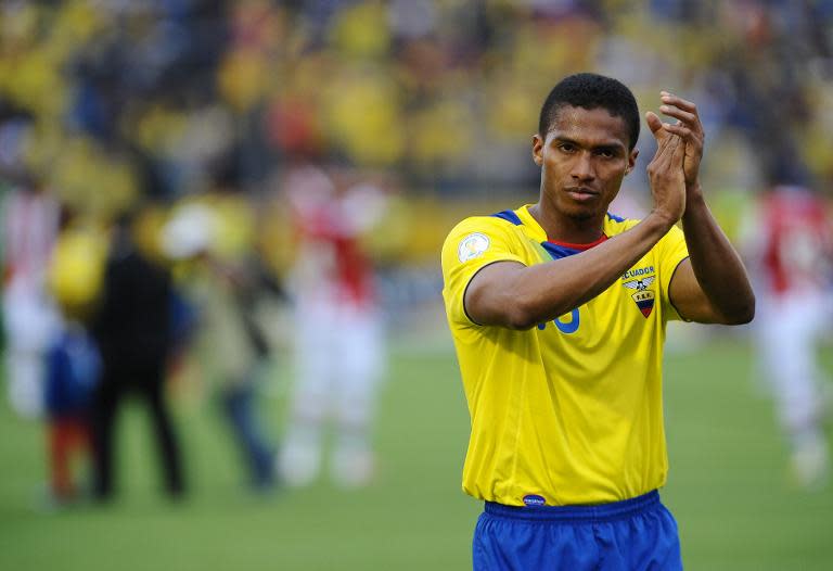 Ecuadorean midfielder Antonio Valencia claps at the end of a World Cup Brazil 2014 qualifying match against Paraguay in Quito, Ecuador on March 26, 2013