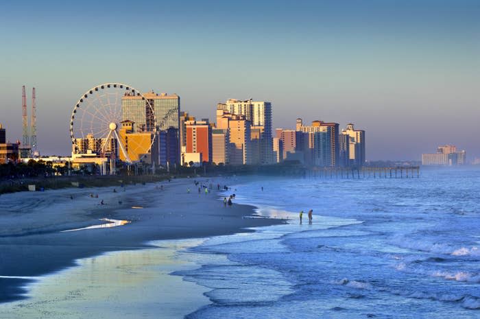 The boardwalk and beach waves in Myrtle Beach, California