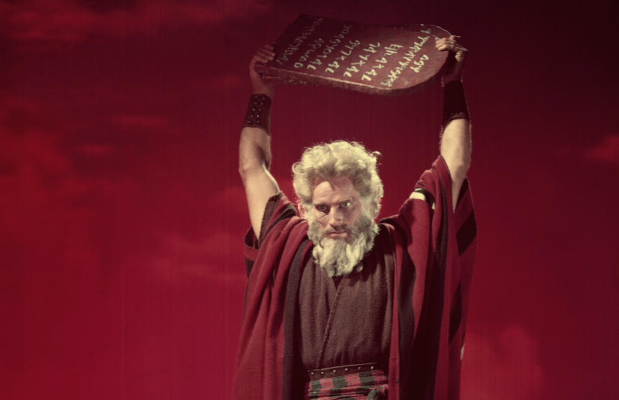 Charlton Heston hoists the Ten Commandments above his head in Cecil B. DeMille's 1956 epic 'The Ten Commandments' (Photo: Courtesy Everett Collection)