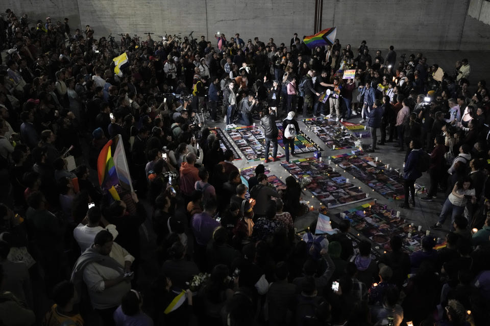 Demonstrators hold a vigil in Mexico City, Monday, Nov. 13, 2023. The first openly nonbinary person to assume a judicial position in Mexico was found dead in their home Monday in the central Mexican city of Aguascalientes after receiving death threats because of their gender identity, authorities said. (AP Photo/Eduardo Verdugo)