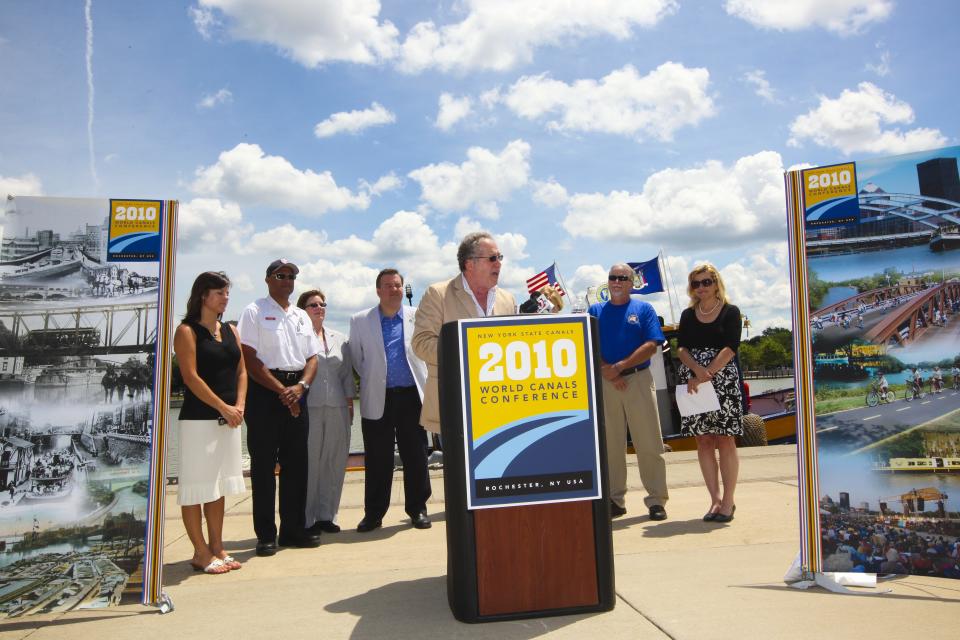 Thomas Grasso, Chairman of World Canals Conference, speaks during a press conference and ceremony at the Corn Hill Landing in Rochester in 2010.