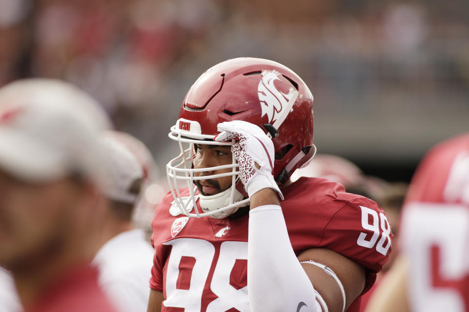 FILE - Washington State defensive lineman Dallas Hobbs (98) stands on the sideline during the first half of an NCAA college football game against Northern Colorado in Pullman, Wash., in this Saturday, Sept. 7, 2019, file photo. Now that he has graduated with a major in digital technology and culture, defensive lineman Dallas Hobbs wants an opportunity to profit off some of his graphic designs while he continues playing football at Washington State. The problem is that he happens to play in one of the states that hasn’t yet passed legislation to help athletes make money off their celebrity while they are still in school.(AP Photo/Young Kwak, File)