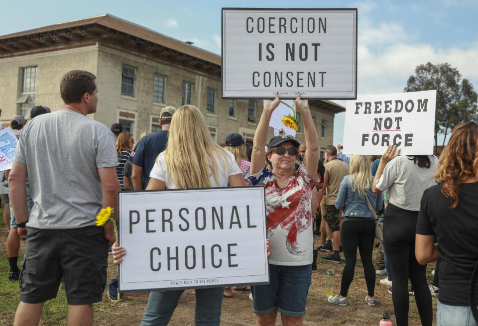 Anti-vaccine protesters stage a protest outside of the San Diego Unified School District office to protest a forced vaccination mandate for students  on September 28, 2021 in San Diego, California. (Sandy Huffaker/Getty Images)