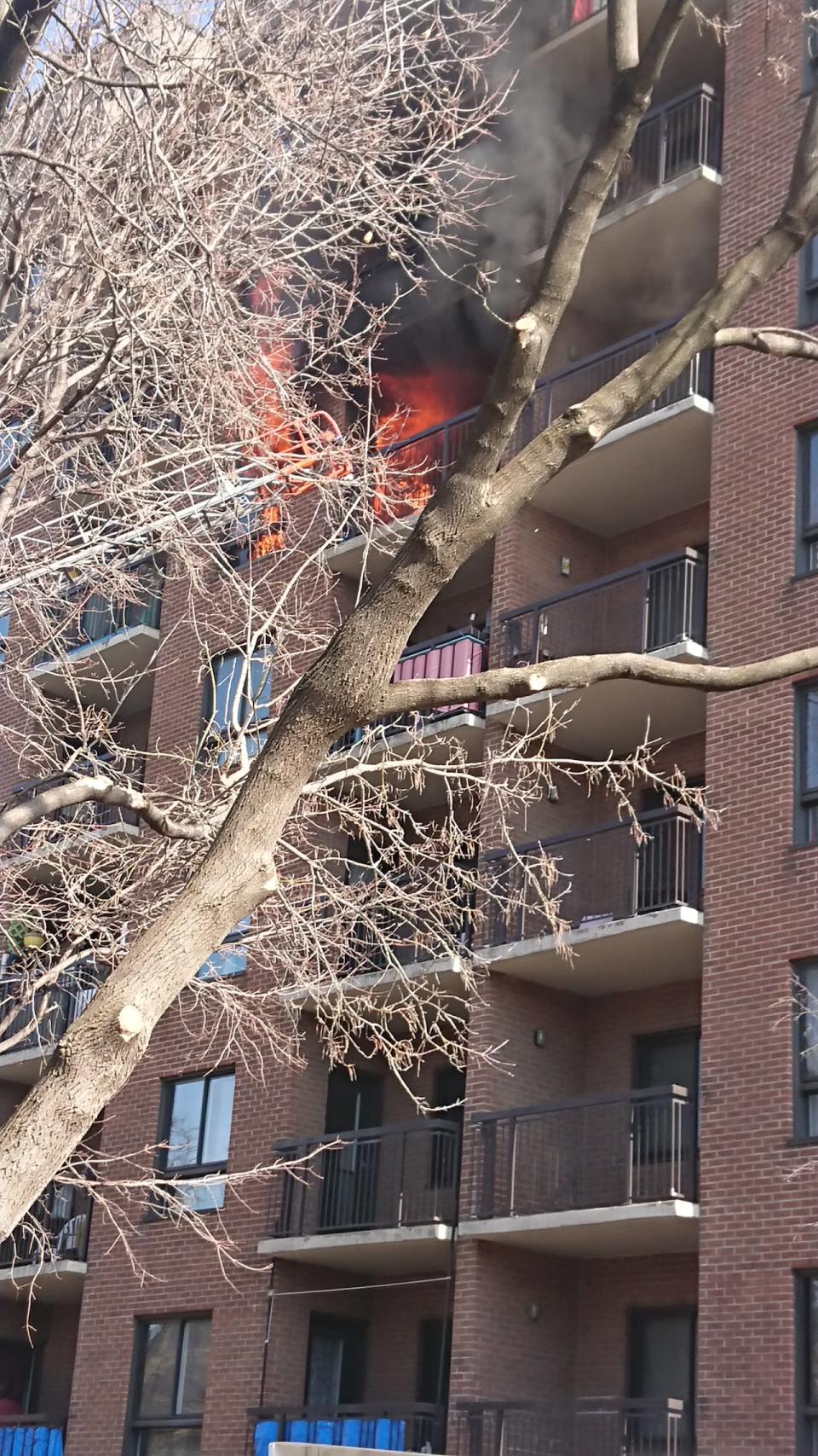 Flames could be seen coming out of at least one unit at an apartment complex on St-Jacques Street in Montreal's Sud-Ouest borough Tuesday afternoon.