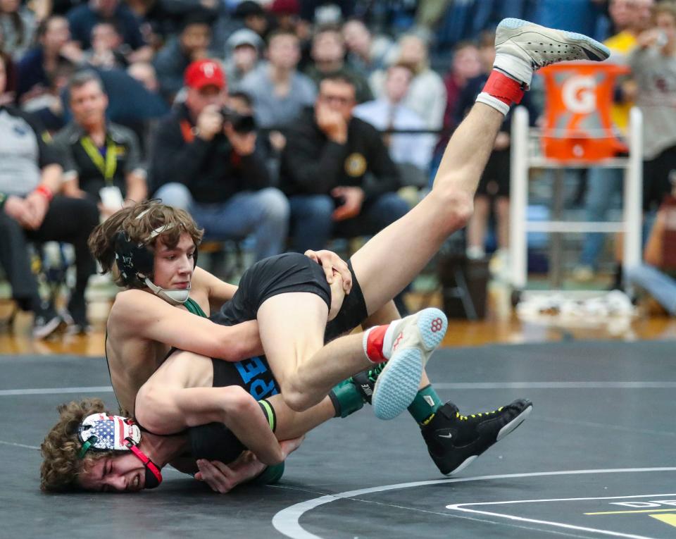 Cape Henlopen's Austin Guerrieri (bottom) and Saint Mark's Clif Bakhsh wrestle at 106 pounds before Guerrieri won in overtime during the DIAA individual wrestling championships, Saturday, March 2, 2024 at Cape Henlopen High School.