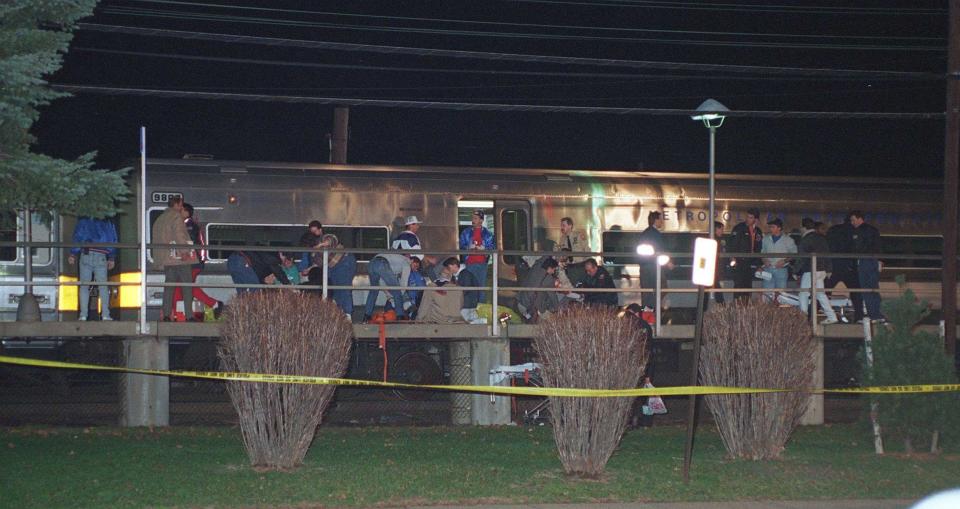 Train passengers are treated on the platform after Colin Ferguson opened fire on the train as it arrived at Garden City, N.Y., on December 7, 1993.<span class="copyright">Alan Raia—Newsday RM/Getty Images</span>