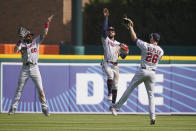 Minnesota Twins outfielders Jake Cave, left, Byron Buxton, center, and Max Kepler celebrate the Twins 3-2 win over the Detroit Tigers in a baseball game, Wednesday, April 7, 2021, in Detroit. (AP Photo/Carlos Osorio)