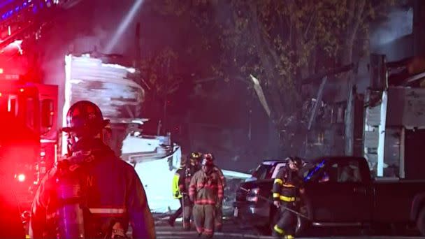 PHOTO: First responders work at the scene where a small plane crashed into a multifamily building in the evening of Oct. 21, 2022 in Keene, N.H. (WCVB)