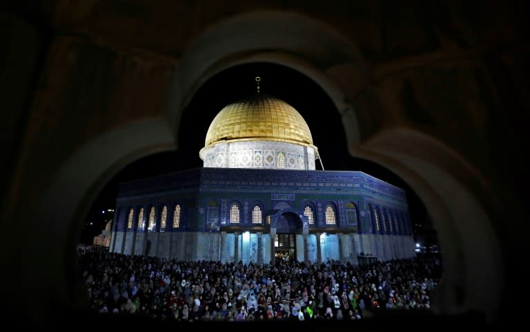 Palestinian Muslim worshippers pray on June 11, 2018 outside the Dome of the Rock in the Al-Aqsa mosques compound in Jerusalem's Old City