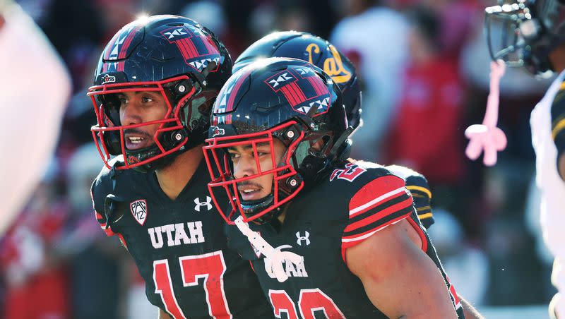 Utah Utes safety Sione Vaki (28) celebrates his touchdown with Utah Utes wide receiver Devaughn Vele (17) against the California Golden Bears in Salt Lake City on Saturday, Oct. 14, 2023. Utah won 34-14.