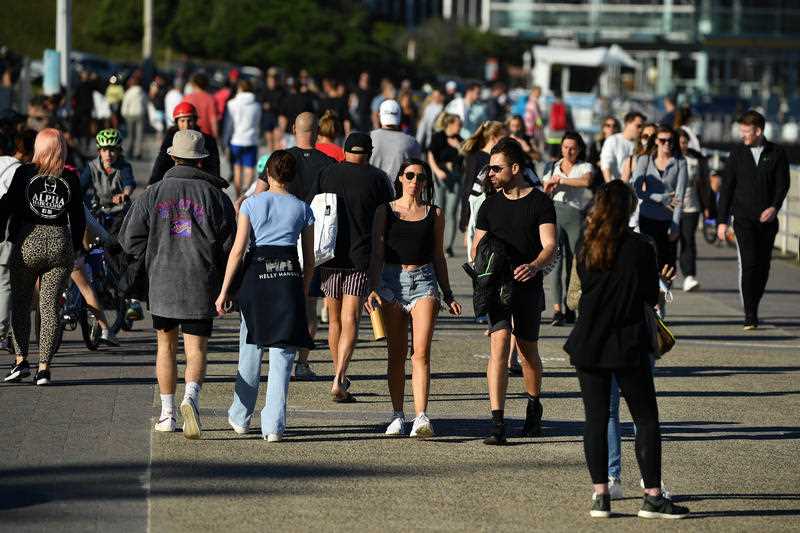 People exercise on the boardwalk at Bondi Beach in Sydney.