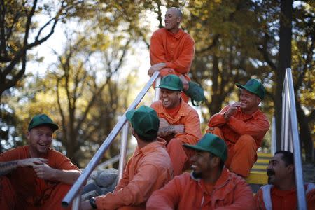 Prison inmates wait to be assigned to work projects at Oak Glen Conservation Fire Camp #35 in Yucaipa, California November 6, 2014. REUTERS/Lucy Nicholson