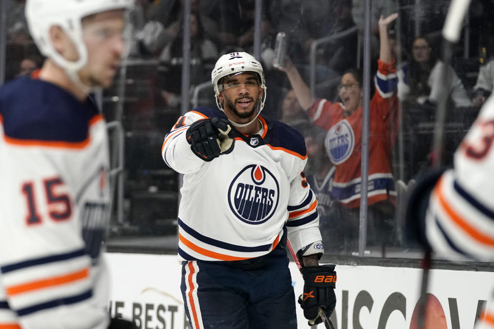 FILE - Edmonton Oilers left wing Evander Kane, center, celebrates his goal during the third period in Game 3 of an NHL hockey Stanley Cup first-round playoff series against the Los Angeles Kings Friday, May 6, 2022, in Los Angeles. It was his third goal of the game. The National Hockey League has taken significant strides in recent years to improve diversity in a sport that has long been predominantly white(AP Photo/Mark J. Terrill, File)