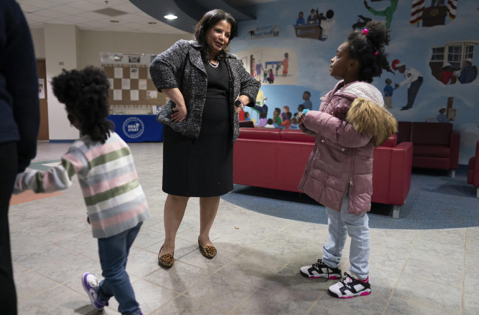 Renee Daniel, the vice president for early childhood education at the Cincinnati-Hamilton County Community Action Agency talks with a student at the Life Learning Center - Head Start, in Cincinnati, Tuesday, Nov. 21, 2023. A new plan from the Biden administration could significantly increase salaries for hundreds of low-paid early childhood teachers caring for the country's poorest children but might also force some centers to cut enrollment. (AP Photo/Carolyn Kaster)