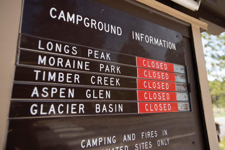 A sign shows that all campgrounds are closed in Rocky Mountain National Park near Estes Park, Colo. on Monday, May 18, 2020. 