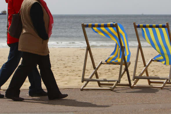 File photo dated 03/05/10 of two women walking along the beach in Bournemouth as one in 12 people planning to retire this year will still be paying off their mortgage. PRESS ASSOCIATION Photo. Issue date: Friday January 24, 2014. Prudential, which carries out research each year to gauge the state of people's finances as they approach retirement, found that one in six (17%) people ending their working lives in 2014 will still be burdened with some form of debt, including mortgages, credit cards or personal loans. Some 8% of those planning to retire in 2014 said they still have not fully paid off their mortgage and around 10% still have credit card debt piled up. On average, those who still have some form of mortgage and/or non-mortgage debt owe ï¿½24,800, although this figure is around one fifth (21%) lower than the typical debt in 2013 of ï¿½31,200, researchers found. Across Britain, Scotland had the highest rate of people retiring this year with debts outstanding. Nearly one quarter (24%) of people retiring in 2014 there said they would have some form of debt. See PA story MONEY Retire. Photo credit should read: Chris Ison/PA Wire