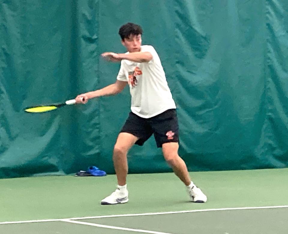 Cathedral Prep's Jonah Ng prepares to hit a baseline volley in his No. 1 singles match against North Catholic's Justin Garvey during Tuesday's PIAA Class 2A boys team tennis tournament dual at Westwood Racquet Club. Ng won as part of Prep's 4-1 victory.
