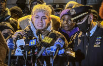 NYPD Officer Sterling Medina, center, grows emotional while remembering his fallen fellow officers at a vigil outside the 32nd precinct honoring officers Jason Rivera and Wilbert Mora in Harlem, Wednesday Jan. 26, 2022, in New York. (AP Photo/Bobby Caina Calvan)