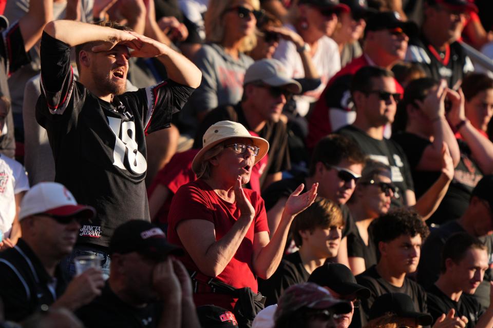 Cincinnati Bearcats fans cheer on the team on a third-down play in the third quarter of a college football game against the Indiana Hoosiers, Saturday, Sept. 24, 2022, at Nippert Stadium in Cincinnati. 