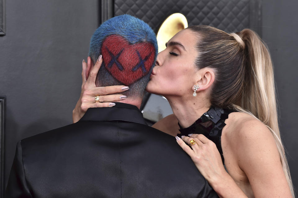 J Balvin, left, and Valentina Ferrer arrive at the 64th Annual Grammy Awards at the MGM Grand Garden Arena on Sunday, April 3, 2022, in Las Vegas. (Photo by Jordan Strauss/Invision/AP)