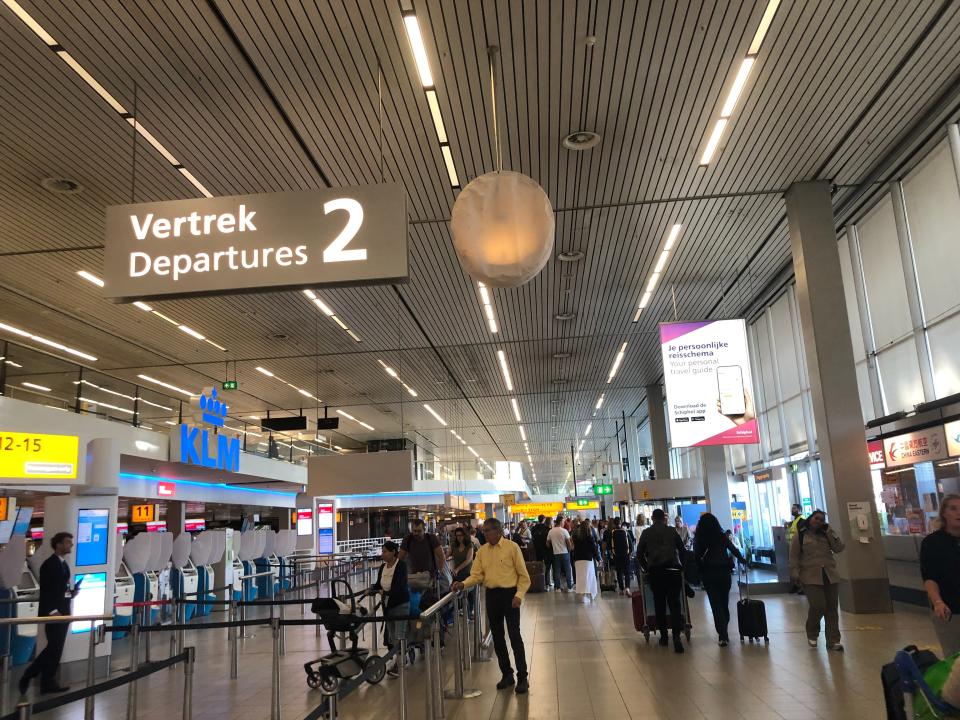 A fairly empty check-in area at Amsterdam Schiphol Airport