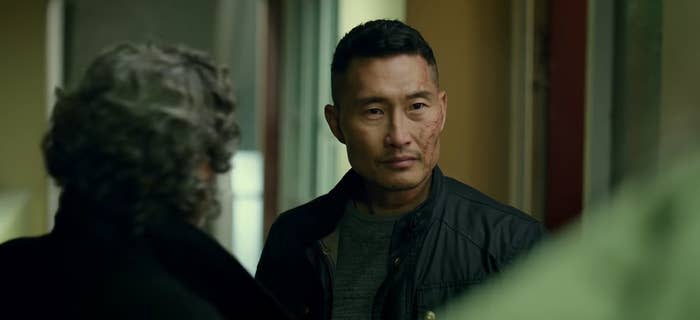 Ben Daimio with Professor Bruttenholm's back turned next to him in "Hellboy" (2019)