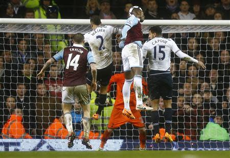 Modibo Maiga of West Ham United heads to score his team's second goal against Tottenham Hotspur during their English League Cup quarter-final soccer match at White Hart Lane, London, December 18, 2013. REUTERS/Andrew Winning