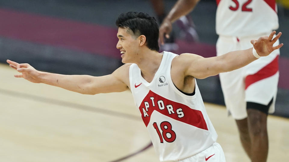 Toronto Raptors' Yuta Watanabe celebrates a three-point basket in the first half of an NBA basketball game against the Cleveland Cavaliers, Saturday, April 10, 2021, in Cleveland. (AP Photo/Tony Dejak)