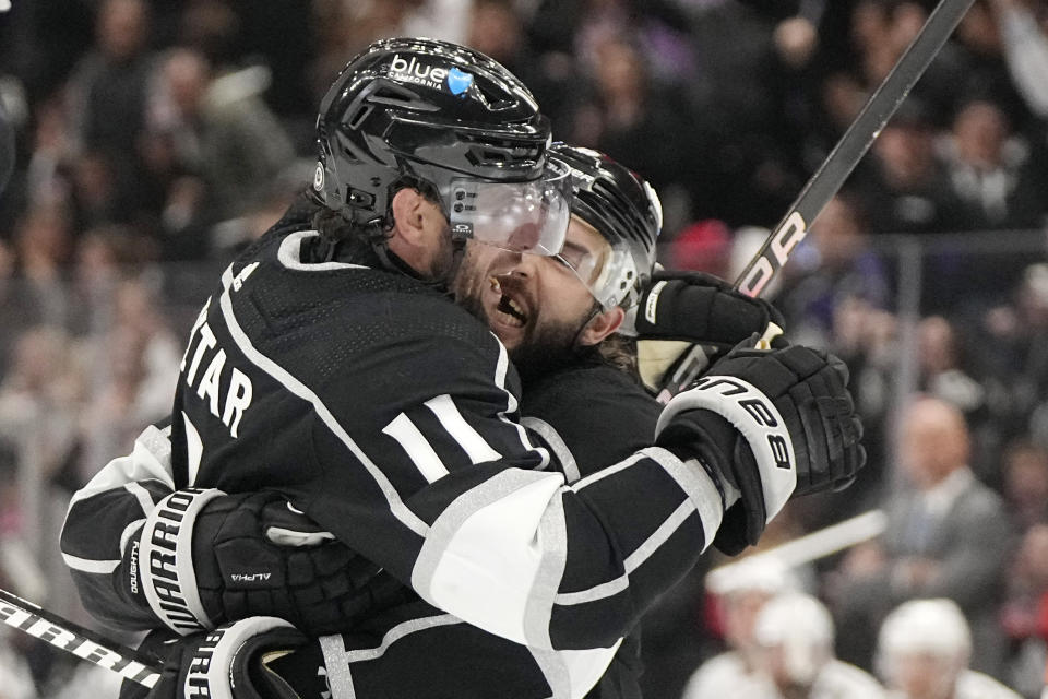 Los Angeles Kings center Anze Kopitar, left, celebrates his goal with defenseman Drew Doughty during the second period of an NHL hockey game against the Florida Panthers Thursday, Nov. 16, 2023, in Los Angeles. (AP Photo/Mark J. Terrill)