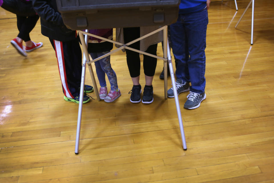 A mother votes in Stamford