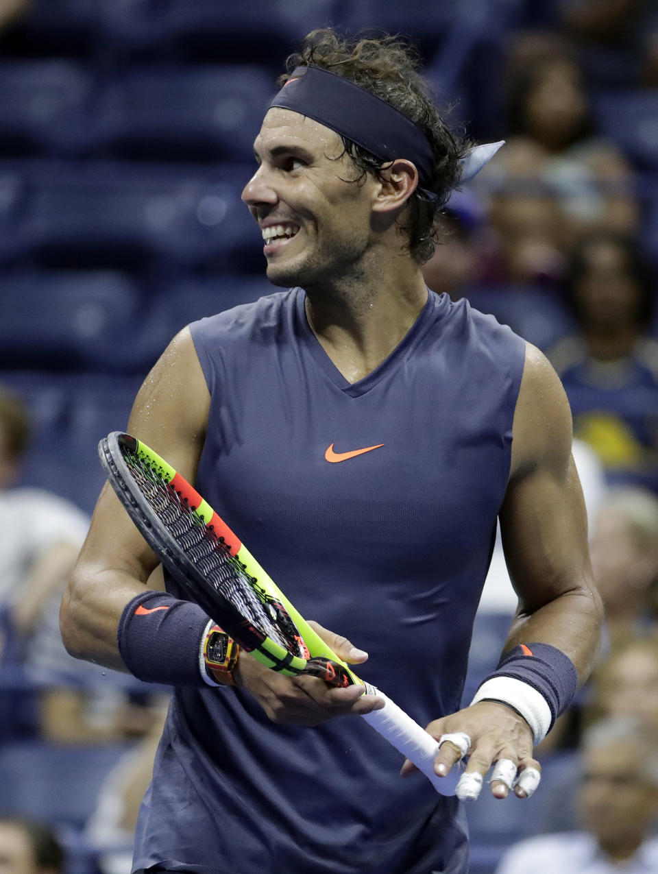 Rafael Nadal, of Spain, reacts after talking to the chair umpire after receiving a warning for letting the serve clock expire during his second-round match against Vasek Pospisil, of Canada, at the U.S. Open tennis tournament, Wednesday, Aug. 29, 2018, in New York. (AP Photo/Julio Cortez)