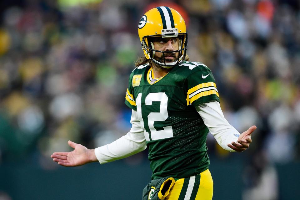 Aaron Rodgers of the Green Bay Packers reacts after throwing an incomplete pass on third down during the first half against the Seattle Seahawks at Lambeau Field on November 14, 2021 in Green Bay, Wisconsin.