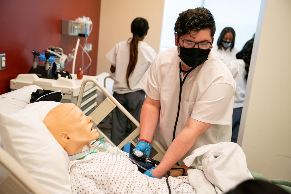 Noah Hunt, a senior at Maplewood High School, works with a simulated patient in the patient care simulation lab at Nashville State Community College in Nashville, Tenn., Thursday, April 22, 2021. Nashville State Community College, HCA Healthcare Foundation/TriStar Health, and Metro Nashville Public Schools have announced an accelerated career pipeline to the high-demand healthcare industry.