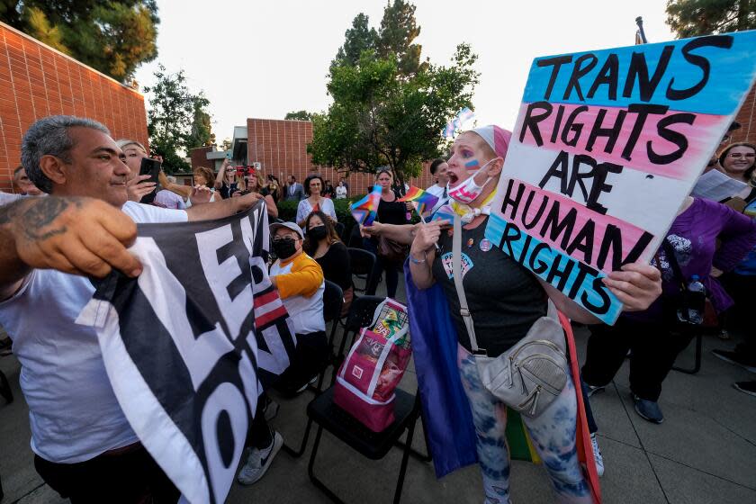 ORANGE CA SEPTEMBER 9, 2023 - Miran Magptyan, left, supporter of transgender notification policy, confronts protestor Micki Simon, right, outside the Orange Unified School District board meeting, Thursday, September 7, 2023 in Orange, California. The Orange Unified School District board will consider a policy Thursday that would require parental notification is their children change their gender identification or pronouns at school. (Photo by Ringo Chiu / For The Times)