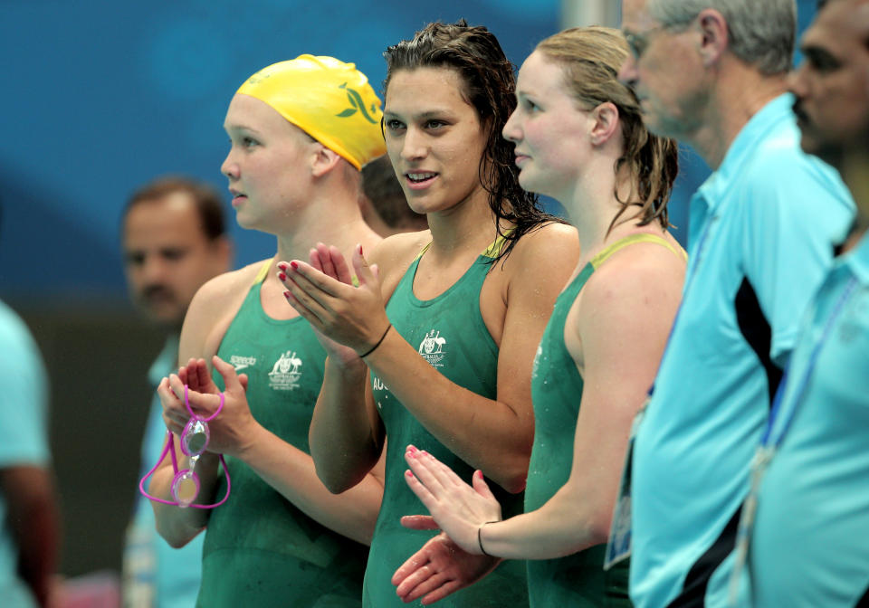 Blair Evans, center, joins Kylie Palmer, left, and Bronte Barratt after winning the women's 4x200m freestyle final at the Dr. S.P. Mukherjee Aquatics Complex during day three of the Delhi 2010 Commonwealth Games on Oct. 6, 2010 in Delhi, India. (Photo by Adam Pretty/Getty Images)